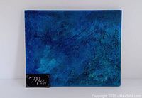 Photo of original acrylic and mixed media painting on board by Monica Lapajne showing a textured abstract blue design.