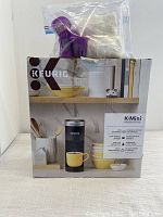 Boxed Keurig K-Mini coffee maker with accessories on top