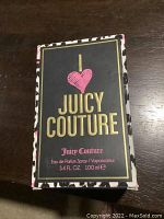 Front view of the Juicy Couture perfume box, showing branding and product details.