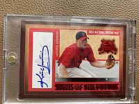 Front of 2004 Fleer Kevin Youkilis red autograph baseball card showing autograph and player image.