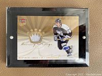 Front view of 2006 Fleer Ultra Scoring Kings Martin St. Louis Patch card showing player image, team uniform, patch piece, and card branding