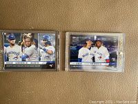 Two 2019 Topps Now rookie cards displayed on a surface, one triple card with Biggio, Guerrero Jr., Bichette, one double card with Biggio and Guerrero Jr.