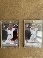 Front view of two Topps Now Vlad Guerrero Jr. Rookie Cards in protective cases, showing Gold Rookie Card text and player in Toronto Blue Jays batting pose.