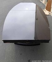 Top view of large cherry brown conference table showing smooth rectangular surface and medium wear along edges