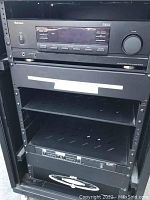 Front close-up showing Sherwood RX-5502 AM/FM 4 channel stereo receiver, shelves and APC power conditioner