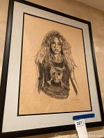 Front view of the framed, signed monochrome drawing of Shakira.