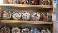 Set of 10 decorative collectible plates on wooden shelves, illustrating Russian fairytale scenes with intricate colorful designs and varied decorative borders.