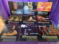 Collection of 9 vintage Great Entertainers records arranged on a table showing front album covers with various designs including guitars, performers, and text.