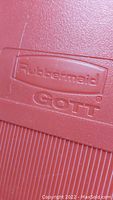 Close-up of Rubbermaid Gott logo embossed on cooler surface, showing the brand and model detail.