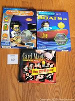 Two Project Kit for Kids boxes and one Card Magic tutorial box shown together, unopened and new.