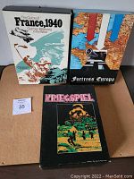 Three vintage WWII themed strategy board games in original boxes: The Game of France 1940, Fortress Europa, Kriegspiel.
