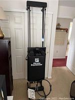 Front view of Pilates Performer exercise machine showing padded backrest, handles, and footrests.