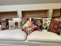 All seven pillows arranged on sofa showing full set