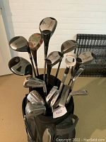 Top view showing multiple club heads with various markings and labels.