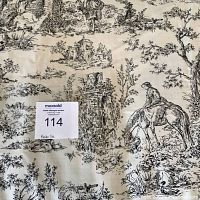 Close-up of black toile pastoral scene print on white duvet fabric