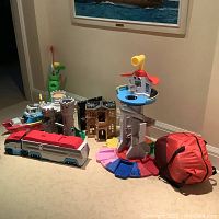 Overall view of all toys laid out on carpet