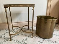 Overview of brass end table and waste paper basket side by side