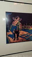 Framed multi-color photoprint of a cow titled 'Annette', showing artistic collage effects and color overlays.
