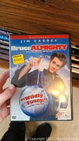Close up of DVD cover Bruce Almighty with Jim Carrey and price sticker