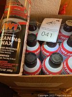 Full case of 12 FW1 High Performance Cleaning Wax cans showing product arrangement inside the box.