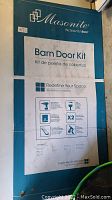 Front of boxed kit showing Masonite brand and Barn Door Kit label