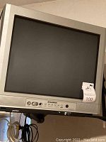 Front view of Sylvania 20-inch color CRT TV with visible buttons and screen