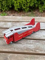 Red and silver Dinky Auto Service toy truck, front and side view showing ramp and cab detail.