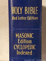 Close-up of spine showing gold text reading: 'HOLY BIBLE Red Letter Edition MASONIC Edition CYCLOPEDIC Indexed'.
