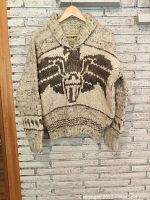 Full front view of the sweater showing the thick knit texture and large eagle design in brown on cream background.