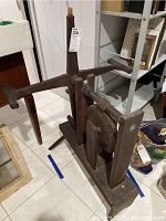 Front and side view of the vintage wooden spooler showing large gear mechanism, crank handle on one side, and missing second handle.