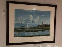 Front photo of the framed print showing coastal scene with lighthouse, signature, and numbering.