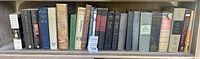 Shelf of around 22 hardcover history books on kings, rulers, and general historical topics
