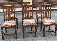 Six antique golden oak straight back dining chairs arranged outdoors showing front and back views with cushions on and off.