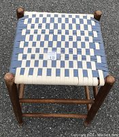 Top view showing the woven narrow tape seat in white and colonial blue in a checkerboard pattern on the Shaker reproduction stool.