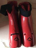 Pair of red Century Tae Kwon Do foot protectors with black ankle straps, good used condition.