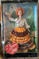 Mattel Barbie Collector I Love Lucy Lucille Ball doll in original box with full costume and accessories visible.
