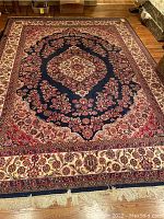 Full view of rug laid flat on hardwood floor