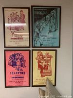 Four framed musical posters on a wall: Yeomen of the Guard, Ruddigore, Iolanthe, The Grand Duke by Ardensingers.