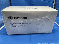 Box packaging showing Fit King brand, product name, model number FT-012A, and key features such as 3 massage modes and air pressure intensities.