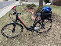 Full view of bike with helmet on rear rack bag