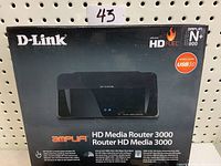 Front of product box showing model D-Link HD Media Router 3000 DIR-857, with labels HD Fuel, Amplifi, N+ 900, USB 3.0