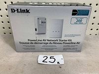Front view of the boxed D-Link PowerLine AV Network Starter Kit showing product image and branding, highlighting up to 200 Mbps speed capability.