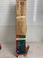 Photo of original packaging box showing brand Holiday Collection and product details: Canadian Pine tree with lights, 3 feet tall
