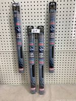 Four sealed packages of Private Eyes 35% window tint hanging on a pegboard.