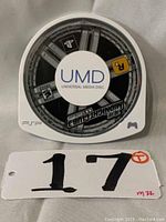 Front view of the Midnight Club 3 Dub Edition UMD disc showing label artwork and markings