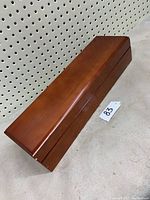 Full view of rectangular wooden tea box showing its shape, size, and finish.