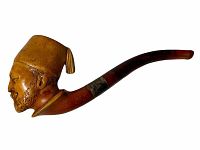 Full side view of the carved pipe showing detail of Turkish man’s head and curved stem.
