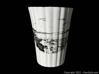 White ceramic cup with black printed image of Norman's Woe rock off Magnolia, Gloucester MA, showing coastal scene.