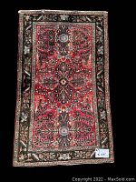 Full view of the Persian rug showing overall pattern and dimensions