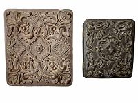 Pair of guttapercha picture frames on white background showing front carved surfaces and design details